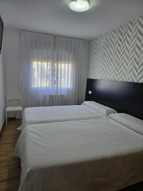 Posteľ alebo postele v izbe v ubytovaní Noja Rooms
