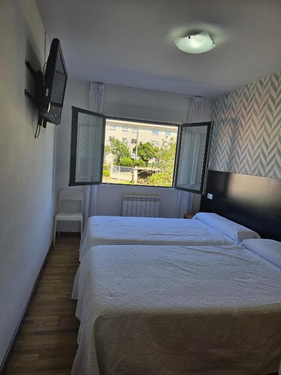 Posteľ alebo postele v izbe v ubytovaní Noja Rooms
