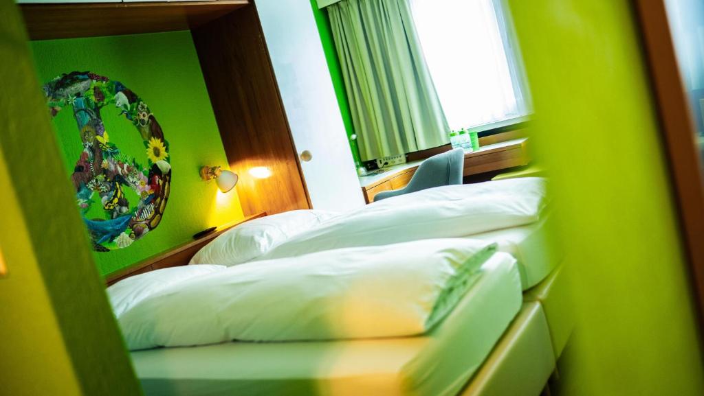 Ein Bett oder Betten in einem Zimmer der Unterkunft Boutique Hotel Kronenhof