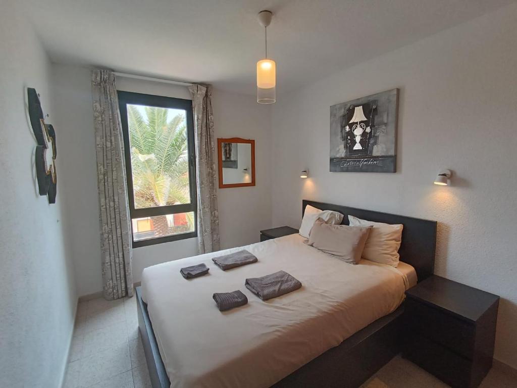 Posteľ alebo postele v izbe v ubytovaní Apartamento SUMMER Complex Amaya Fuerteventura