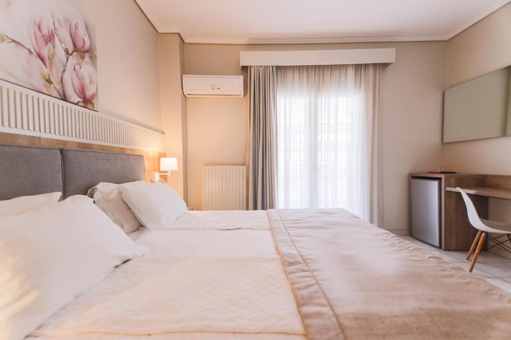 Postel nebo postele na pokoji v ubytování Hotel Strass