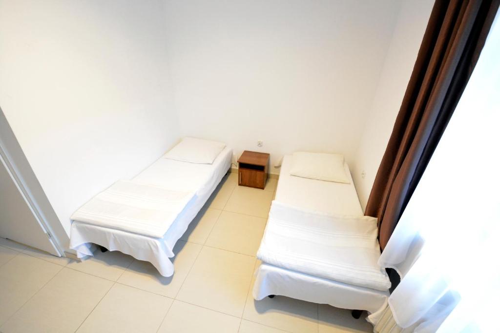 Postel nebo postele na pokoji v ubytování Twój Hostel Klimczoka 7