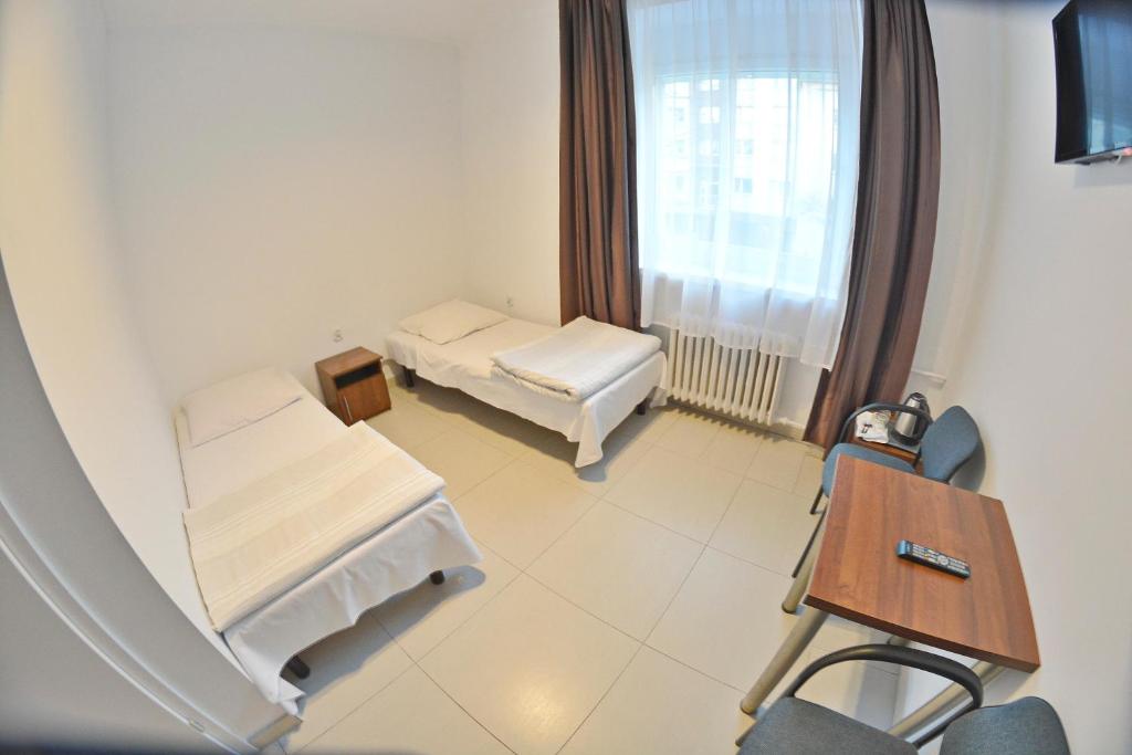 Postel nebo postele na pokoji v ubytování Twój Hostel Klimczoka 7