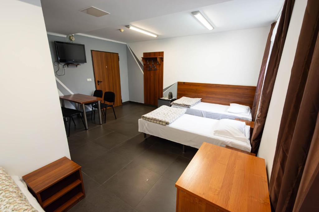 Postel nebo postele na pokoji v ubytování Twój Hostel Klimczoka 7
