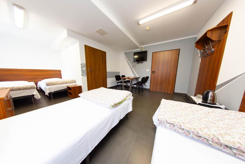 Postel nebo postele na pokoji v ubytování Twój Hostel Klimczoka 7