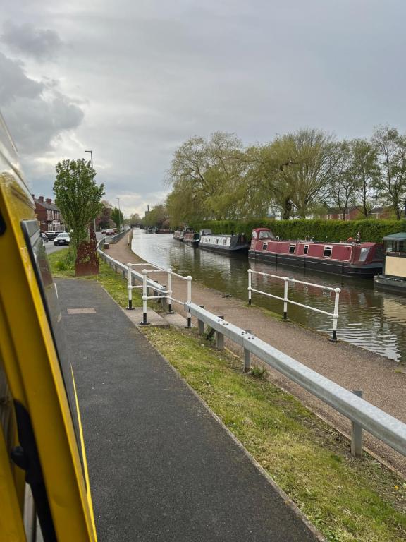 a view of a river with boats in it at Waterside campervan in Manchester