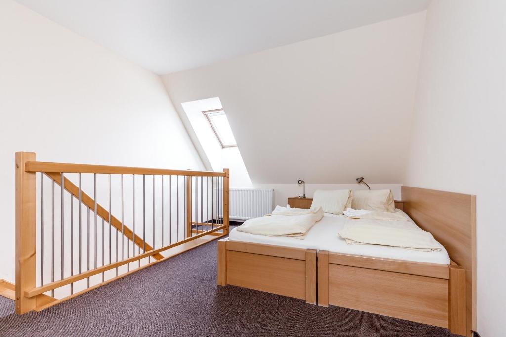 Postel nebo postele na pokoji v ubytování Penzion a Apartmány Daro