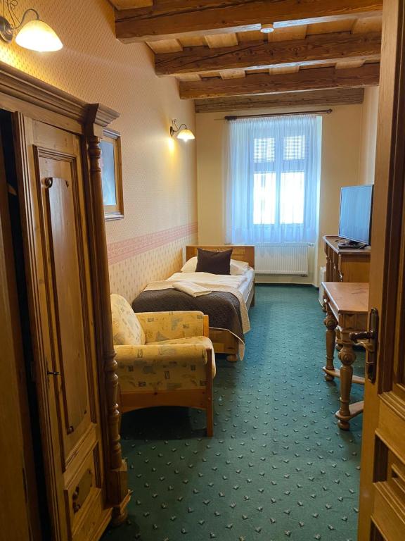 Postel nebo postele na pokoji v ubytování Hotel & Caffe Silesia