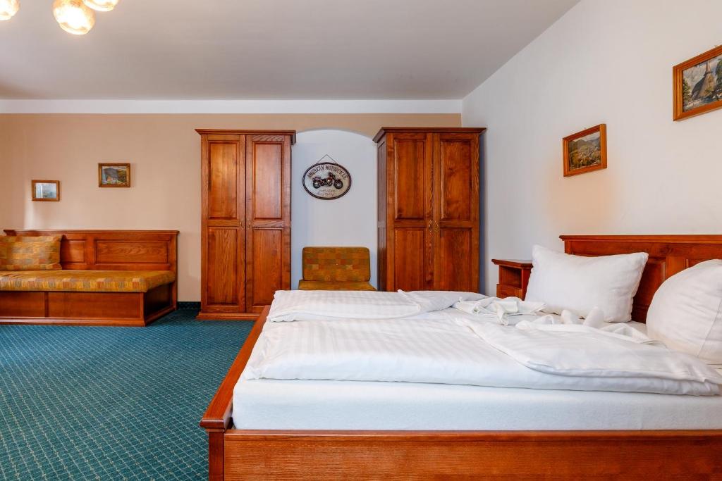 Postel nebo postele na pokoji v ubytování Penzion a Apartmány Daro