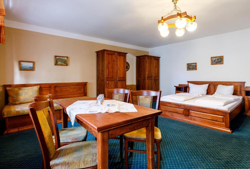 Postel nebo postele na pokoji v ubytování Penzion a Apartmány Daro
