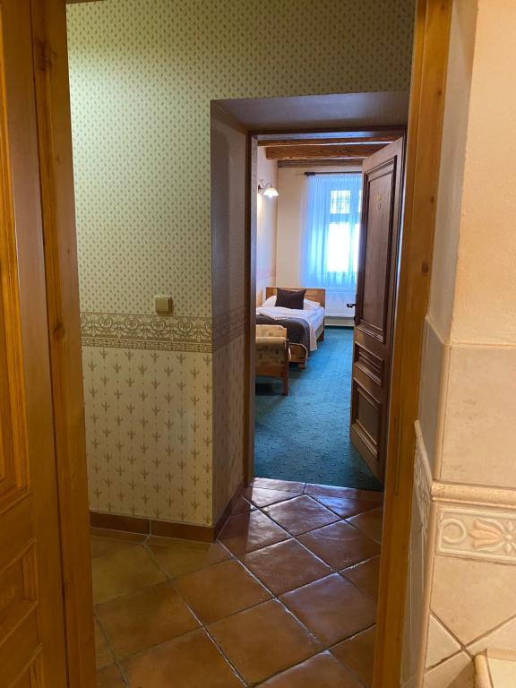 Postel nebo postele na pokoji v ubytování Hotel & Caffe Silesia