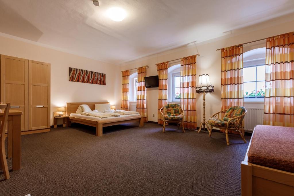 Postel nebo postele na pokoji v ubytování Penzion a Apartmány Daro