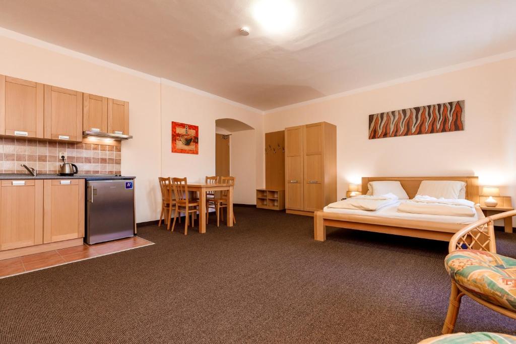 Postel nebo postele na pokoji v ubytování Penzion a Apartmány Daro