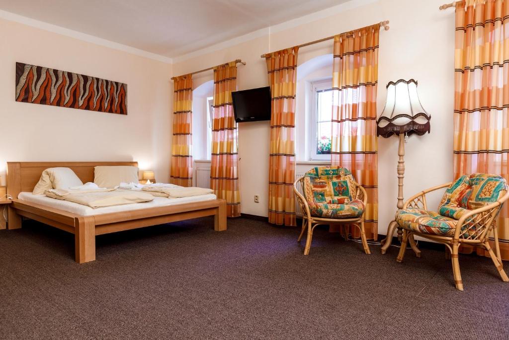 Postel nebo postele na pokoji v ubytování Penzion a Apartmány Daro