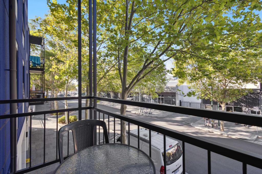 a balcony with a chair and a tree at 2BDR 1BTH 1PRK - Northbridge Magic in Perth