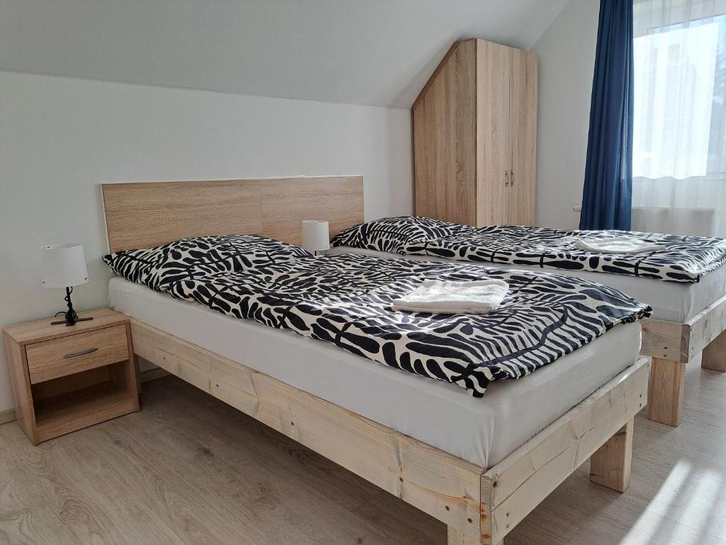 Postel nebo postele na pokoji v ubytování Apartmány Amália