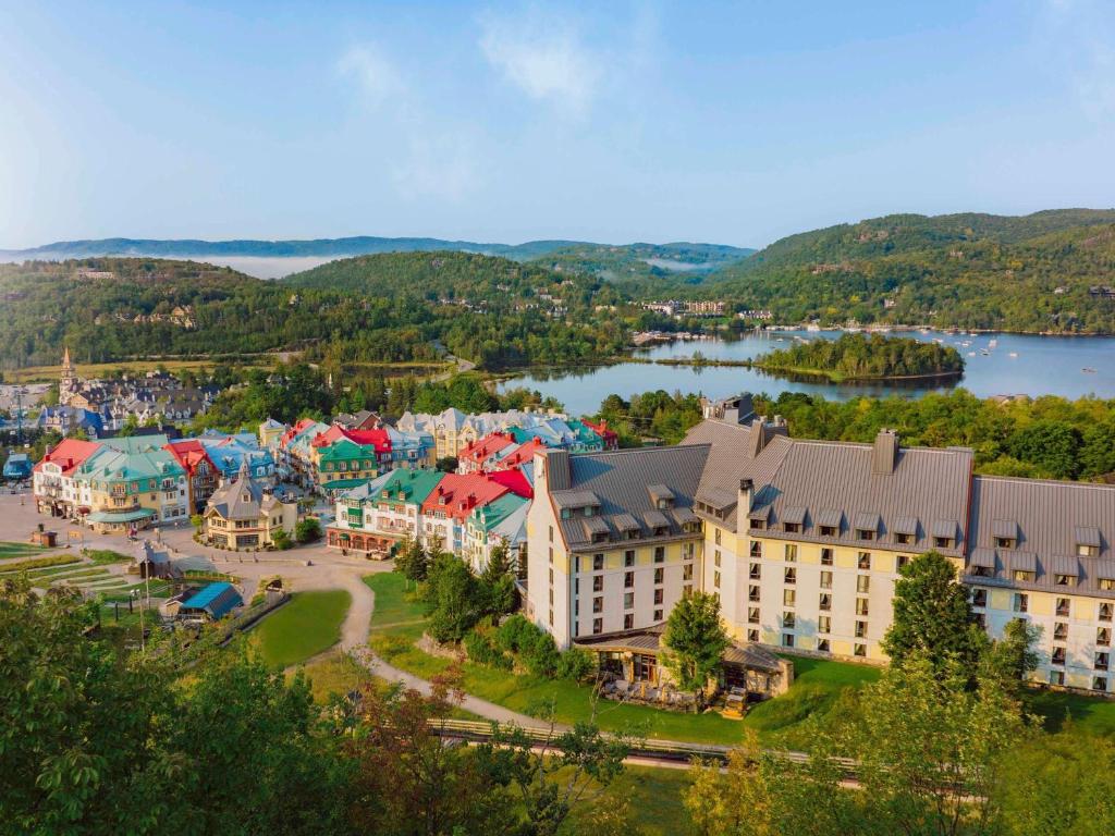 an aerial view of a resort with a lake at Fairmont Tremblant in Mont-Tremblant