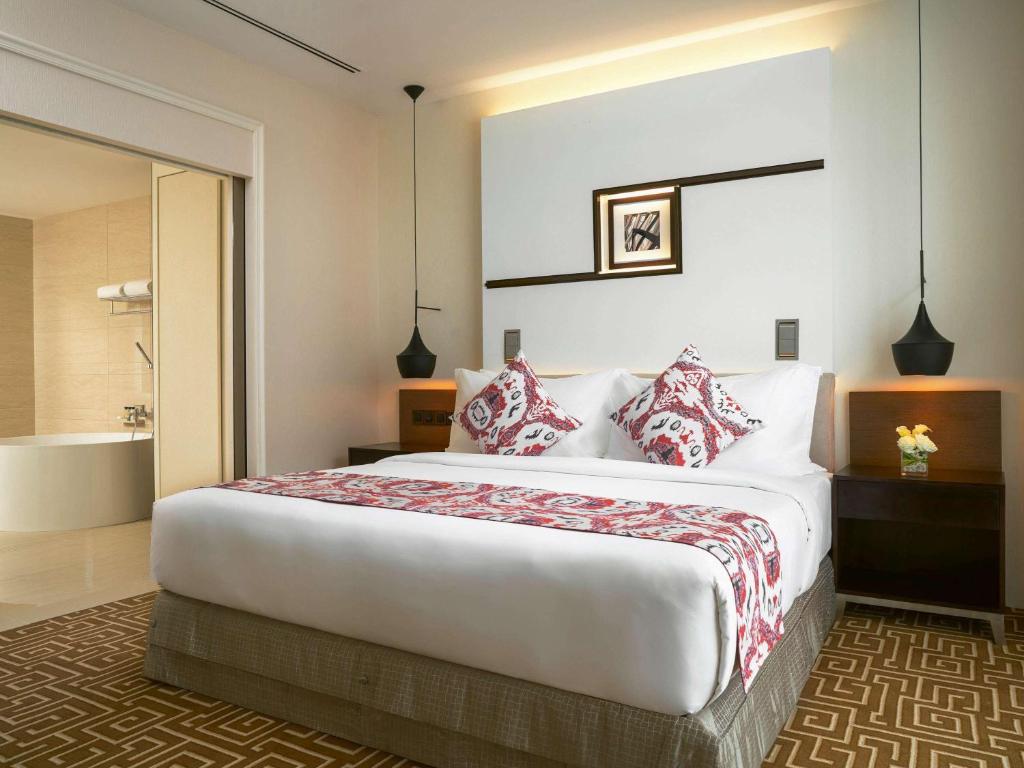 Postel nebo postele na pokoji v ubytování Movenpick Hotel & Convention Centre KLIA