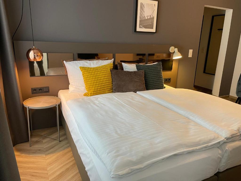 Postel nebo postele na pokoji v ubytování Dom Hotel