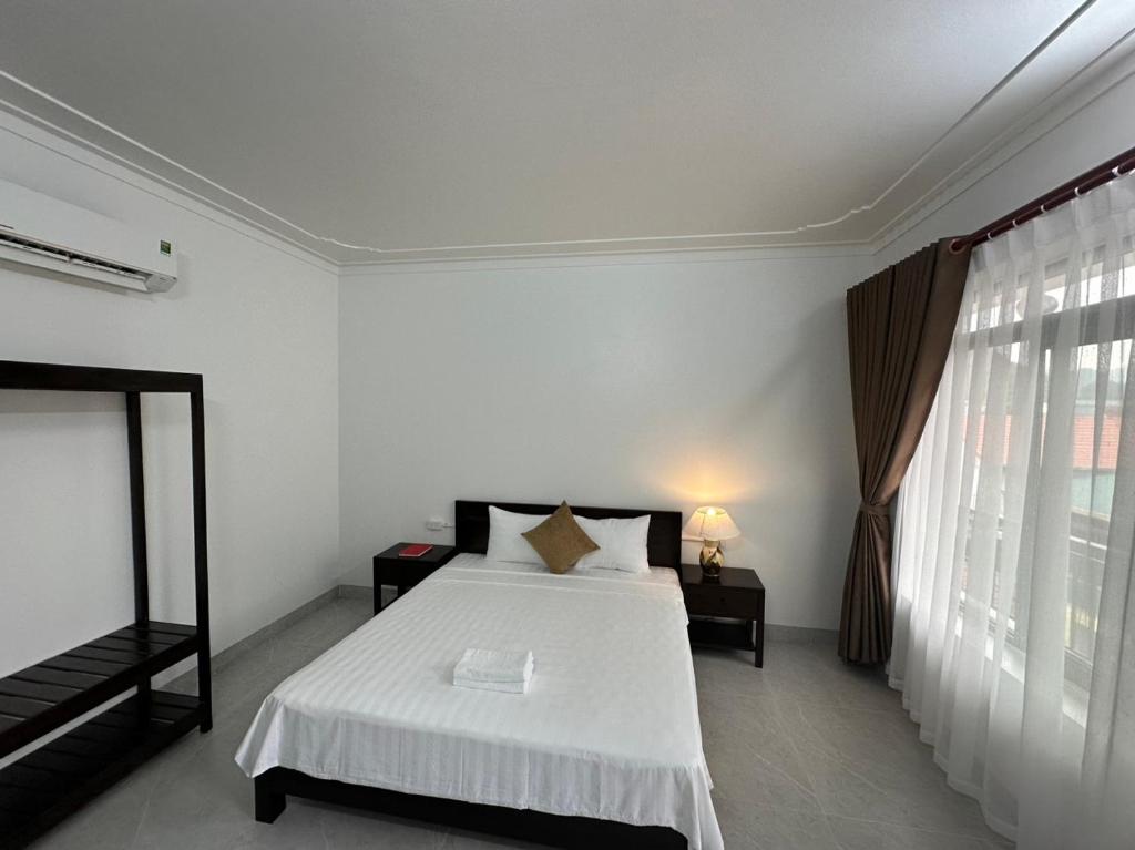 Postel nebo postele na pokoji v ubytování Tam Cốc LullaBy Homestay