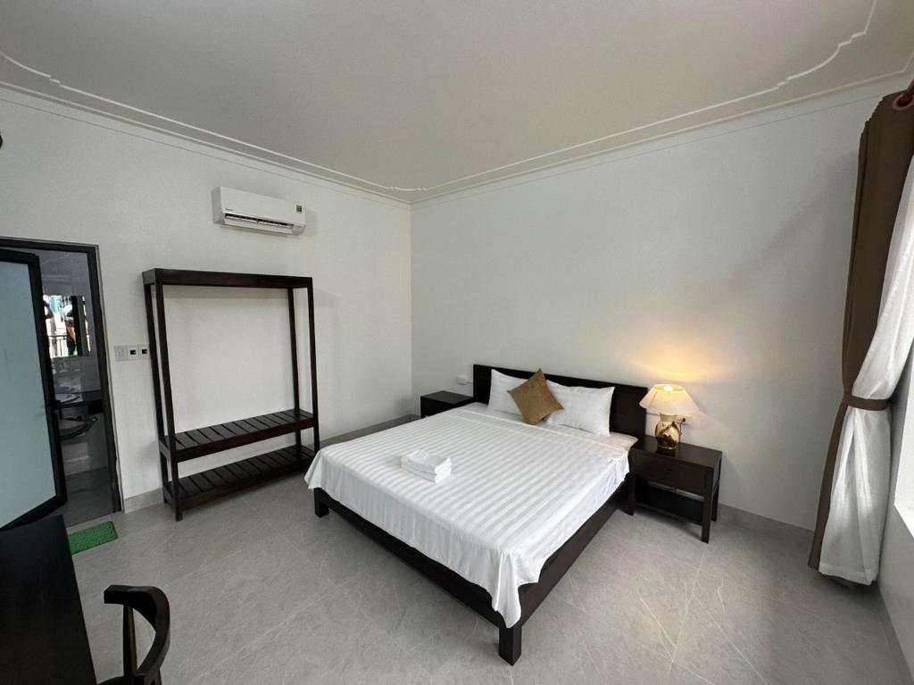 Postel nebo postele na pokoji v ubytování Tam Cốc LullaBy Homestay