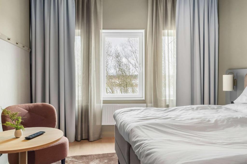 Postel nebo postele na pokoji v ubytování Aiden by Best Western Karlstad Arena