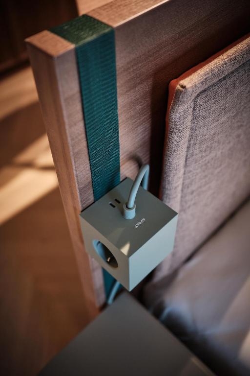 a book with a adapter on the side of it at The Zipper Hotel und Apartments in Düsseldorf