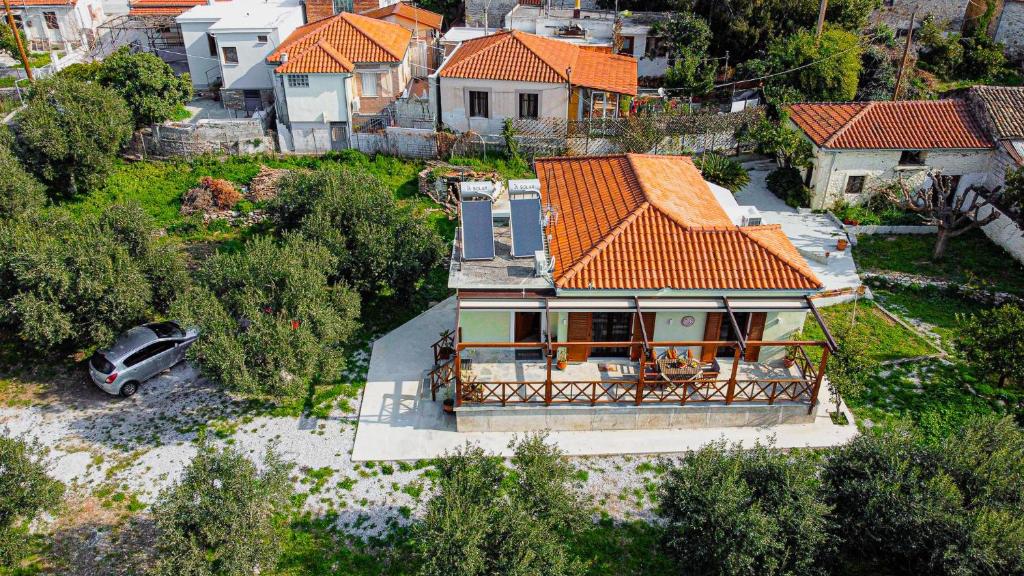 an aerial view of a house with an orange roof at Myrtilli Cottages Pelion in Áno Lekhónia