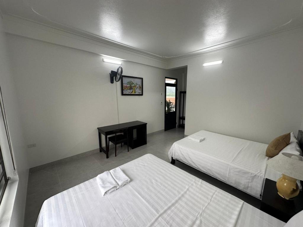 Postel nebo postele na pokoji v ubytování Tam Cốc LullaBy Homestay