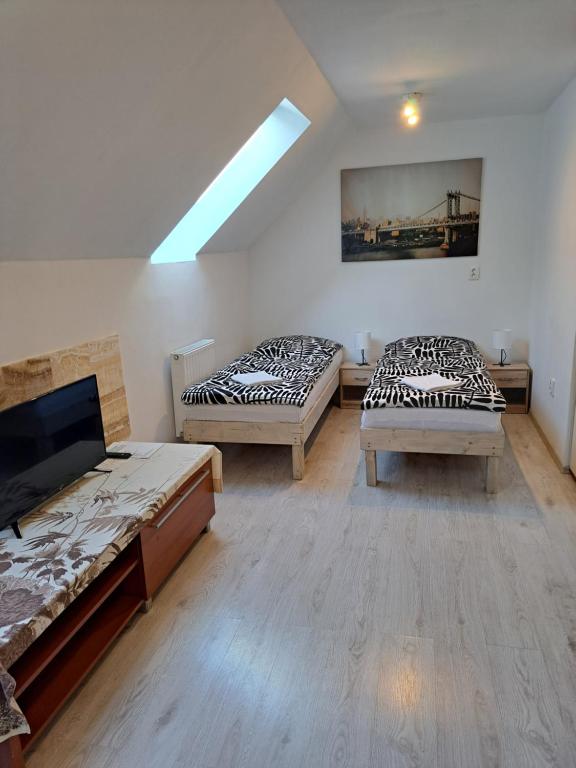 Postel nebo postele na pokoji v ubytování Apartmány Amália