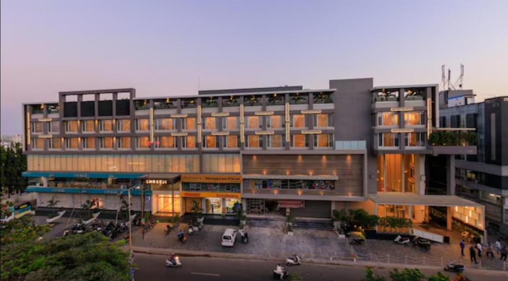 a large building with people walking in front of it at Sayaji Jamnagar in Jamnagar