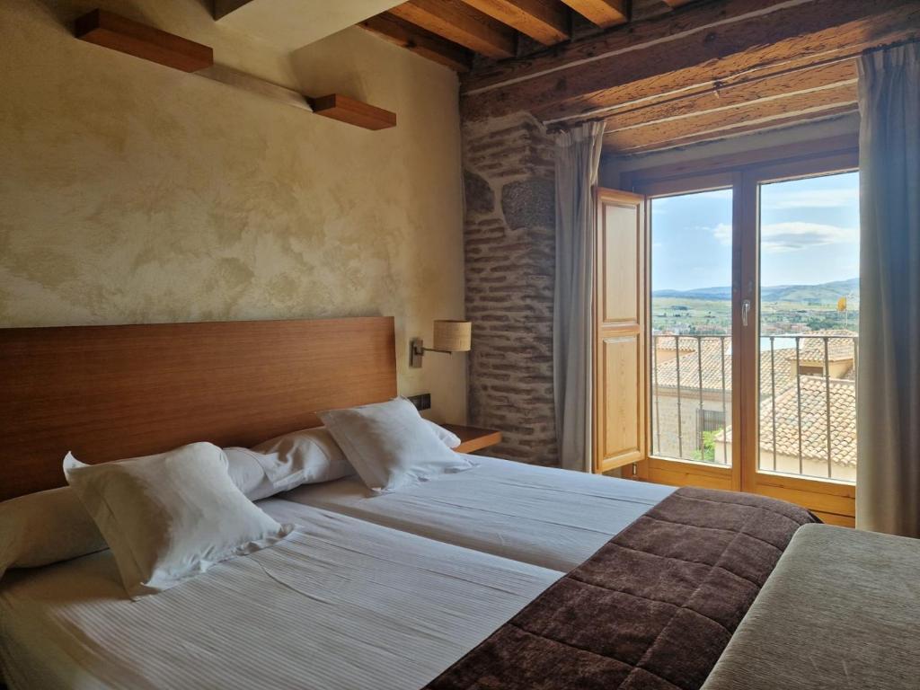 Postel nebo postele na pokoji v ubytování Hotel Las Leyendas