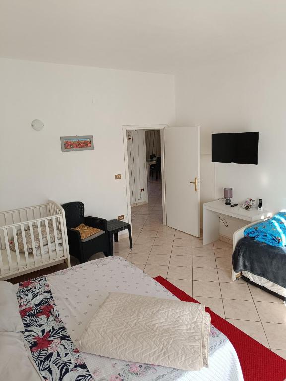 Posteľ alebo postele v izbe v ubytovaní L'appartamento delle vacanze