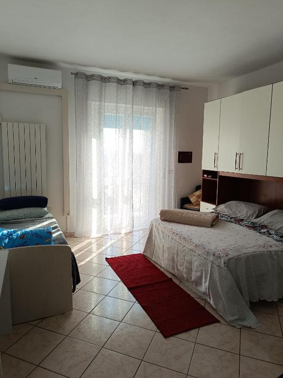 Posteľ alebo postele v izbe v ubytovaní L'appartamento delle vacanze