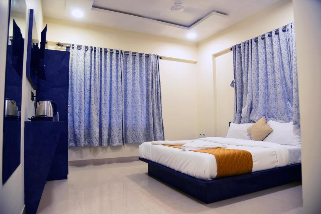 En eller flere senge i et værelse på Hotel Edition Blue