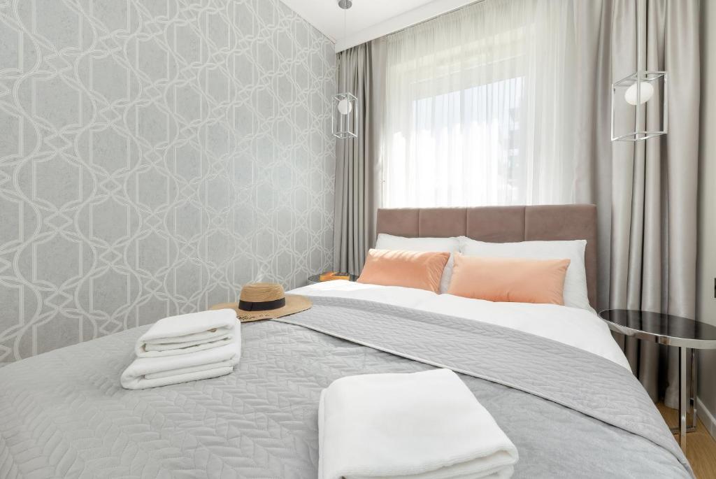 Posteľ alebo postele v izbe v ubytovaní Seaside Apartamenty Porta Mare I Kołobrzeg