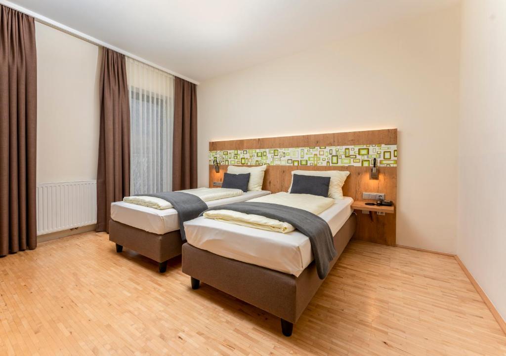 Postel nebo postele na pokoji v ubytování Hotel Heffterhof