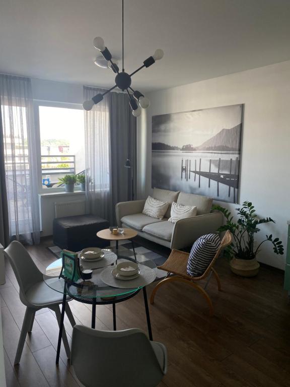 a living room with a couch and a table at Apartman pri Radnici in Košice