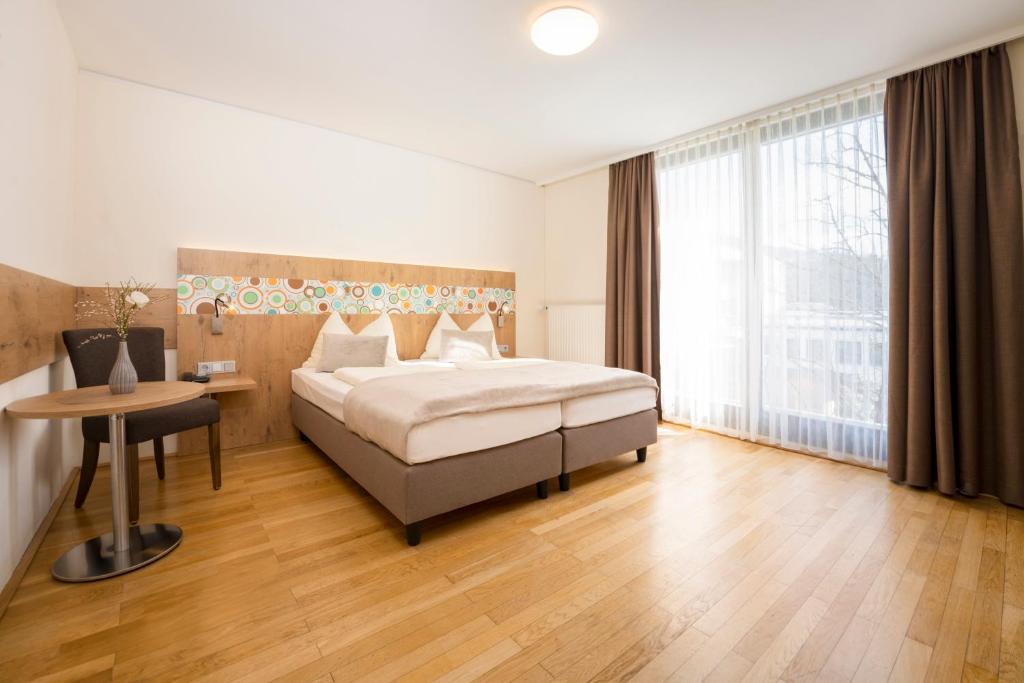 Postel nebo postele na pokoji v ubytování Hotel Heffterhof