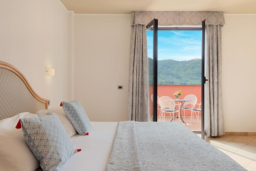 Ein Bett oder Betten in einem Zimmer der Unterkunft Park Hotel Argento