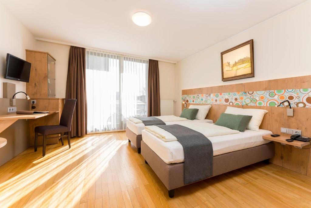 Postel nebo postele na pokoji v ubytování Hotel Heffterhof