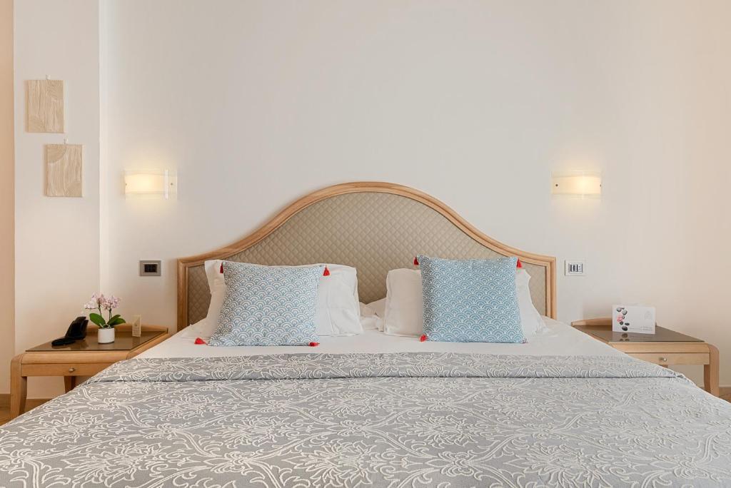 Ein Bett oder Betten in einem Zimmer der Unterkunft Park Hotel Argento
