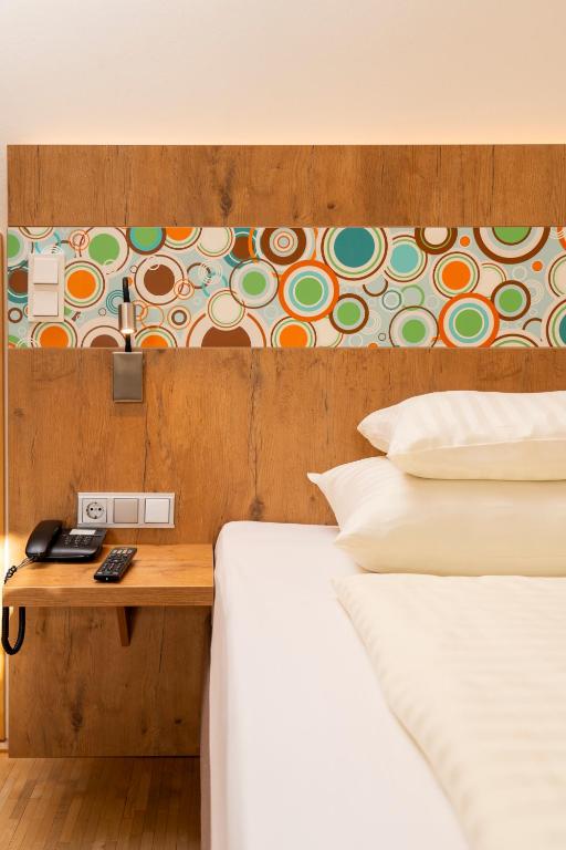 Postel nebo postele na pokoji v ubytování Hotel Heffterhof