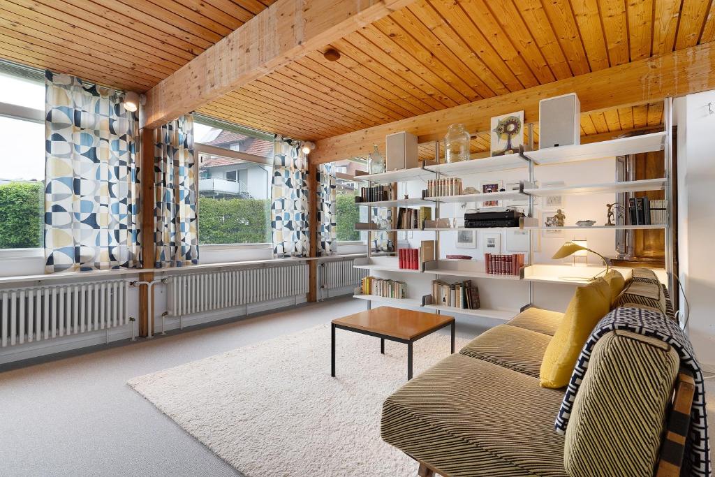 a living room with a couch and a table at Haus Erika in Alpirsbach