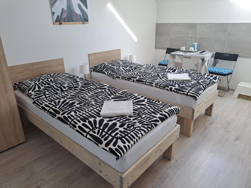 Postel nebo postele na pokoji v ubytování Apartmány Amália
