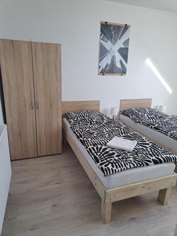 Postel nebo postele na pokoji v ubytování Apartmány Amália