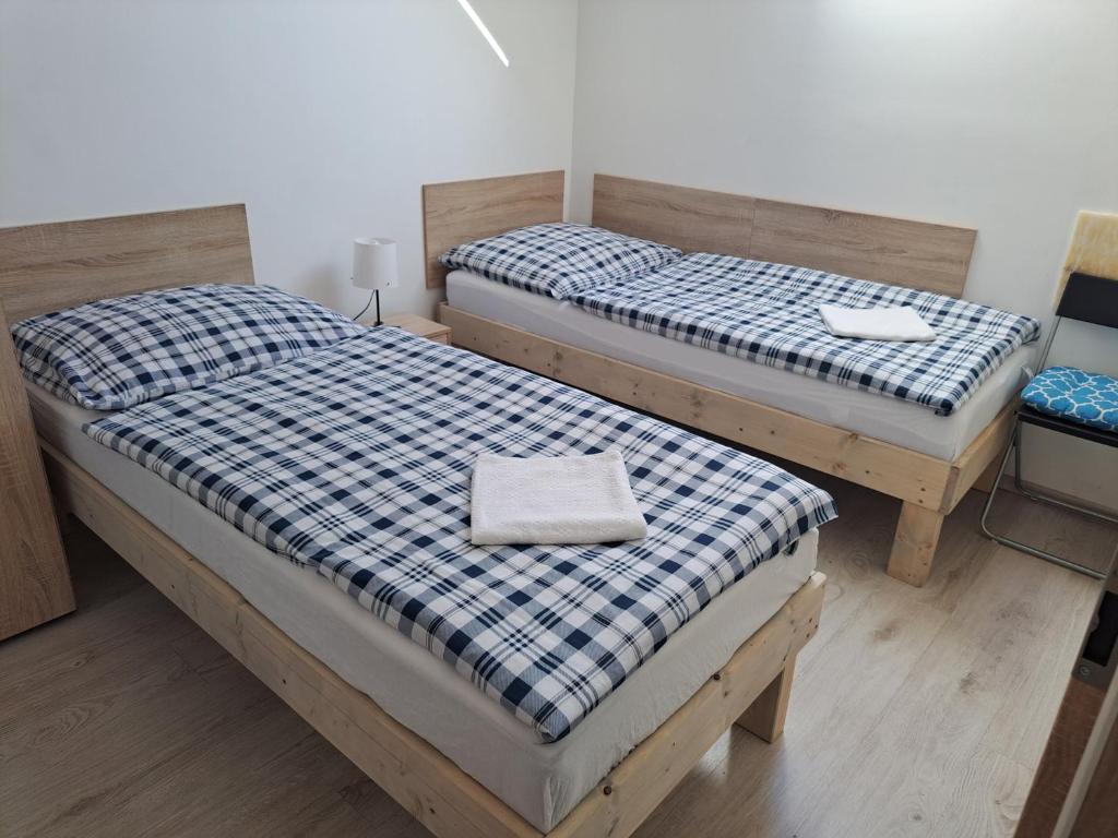 Postel nebo postele na pokoji v ubytování Apartmány Amália