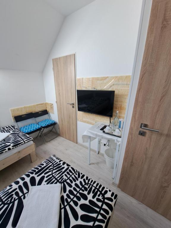 Postel nebo postele na pokoji v ubytování Apartmány Amália