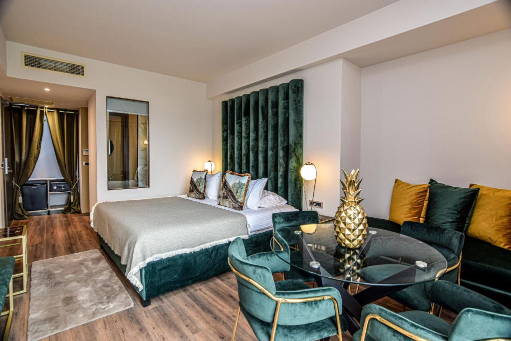Postel nebo postele na pokoji v ubytování Golden Rooms