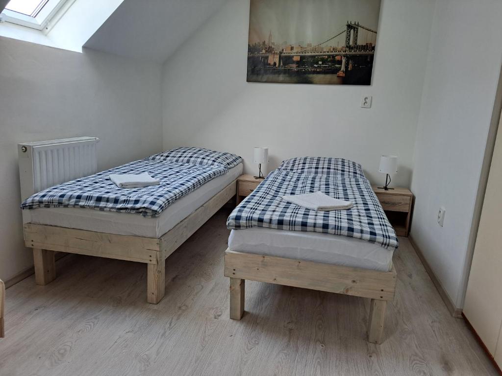 Postel nebo postele na pokoji v ubytování Apartmány Amália